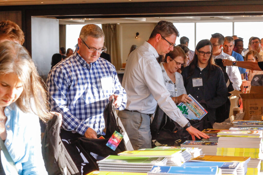 Photo of Nitsch employees and clients packaging backpacks for students in need