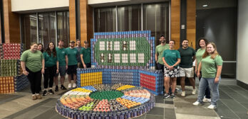 Nitsch Team members standing around Canstruction 2025 structure