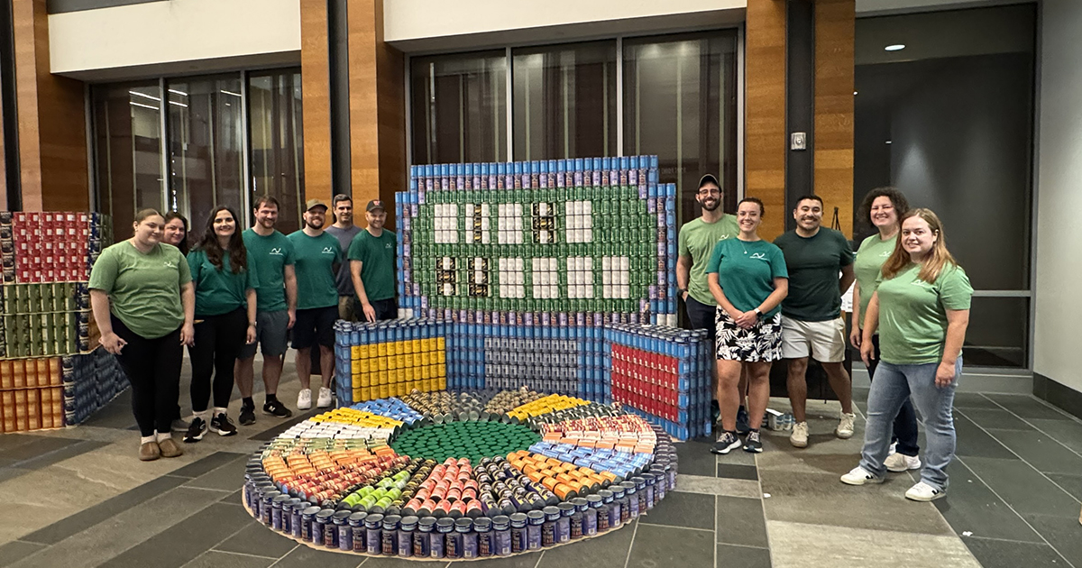 Nitsch Team members standing around Canstruction 2025 structure