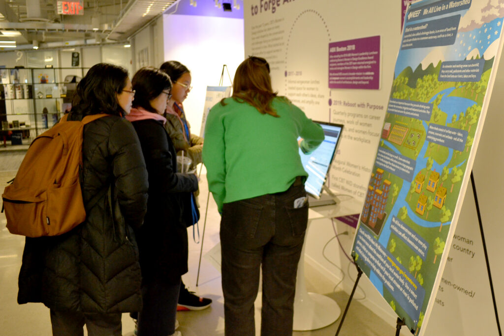 Students looking at computer
